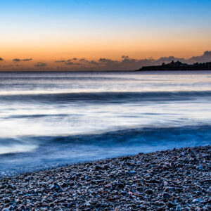 Pebble Sunrise Dawn breaking at Swanage Bay